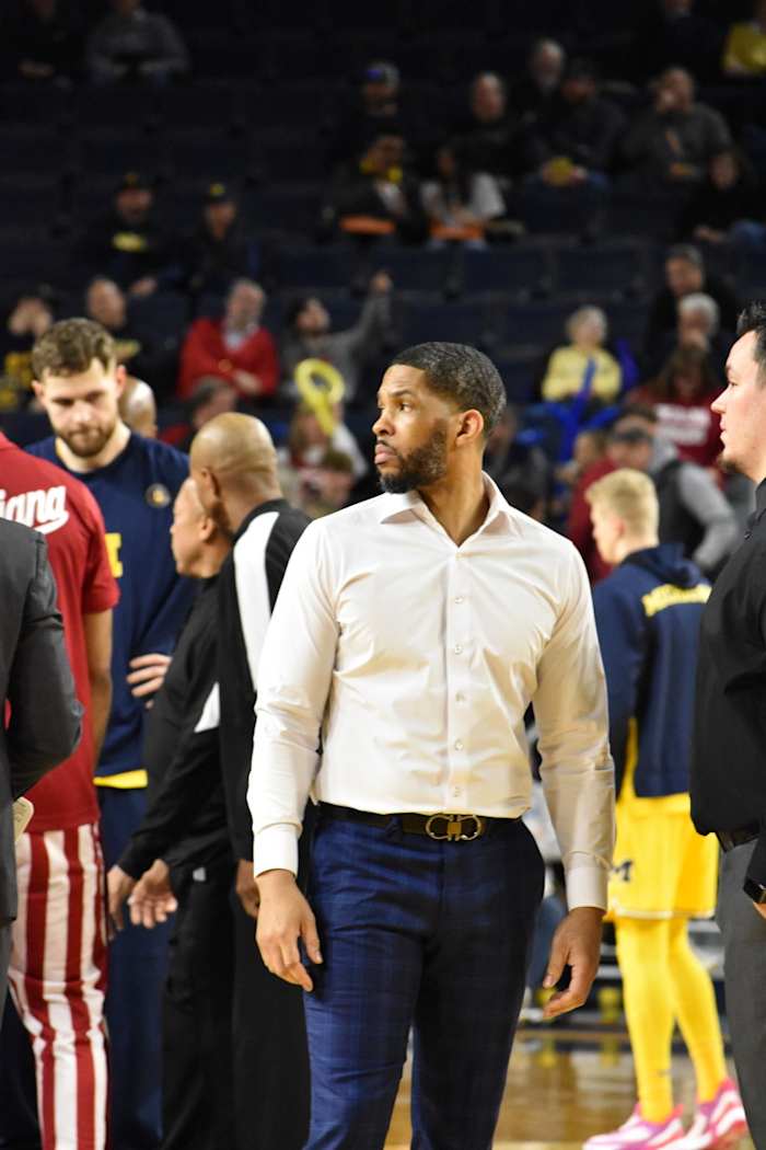 Coach Yasir Rosemond oversees the Hoosiers warming up before their matchup with the Michigan Wolverines.